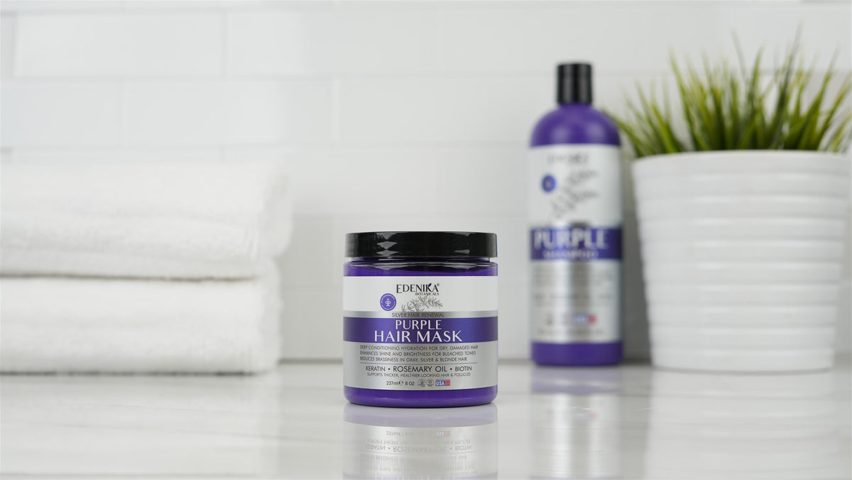 Edenika Purple Hair Mask and Purple Shampoo beside white towels and greenery