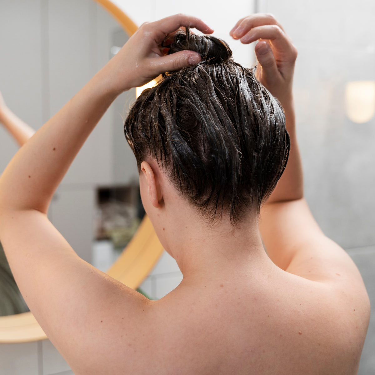 Applying care to damp hair as part of a daily routine